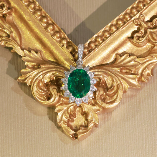 Royal Inspired Oval Created Emerald Halo Pendant Necklace | Classic Elegance